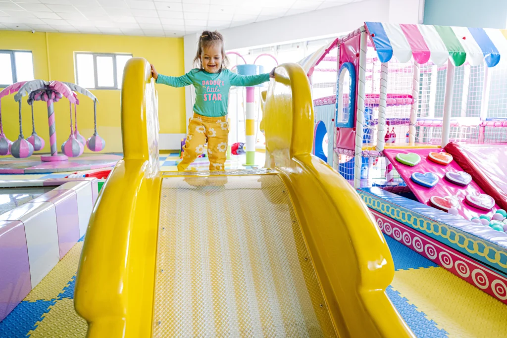 The toddler enjoys the soft play area, designed for safe, age-appropriate fun.